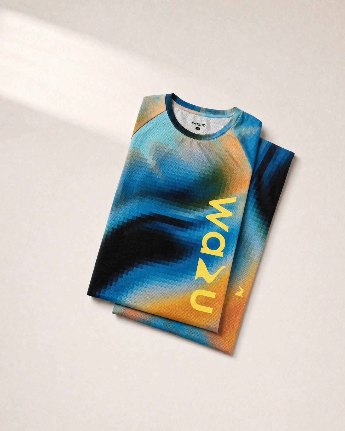 Blending Flow Tee folded on the approved sunlit product-shot background